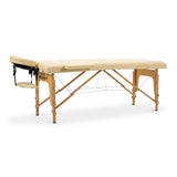 Nourest portable foldable massage table in beige color with an adjustable headrest and sturdy wooden frame.